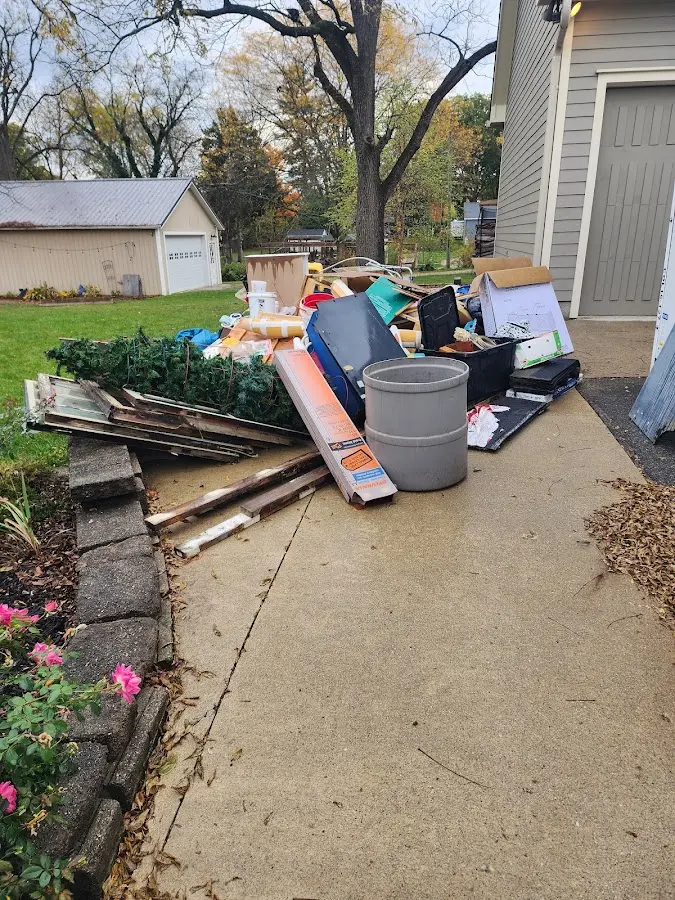 Dumpster being loaded with debris for Estate Cleanout Dumpster Rental in Parowan
